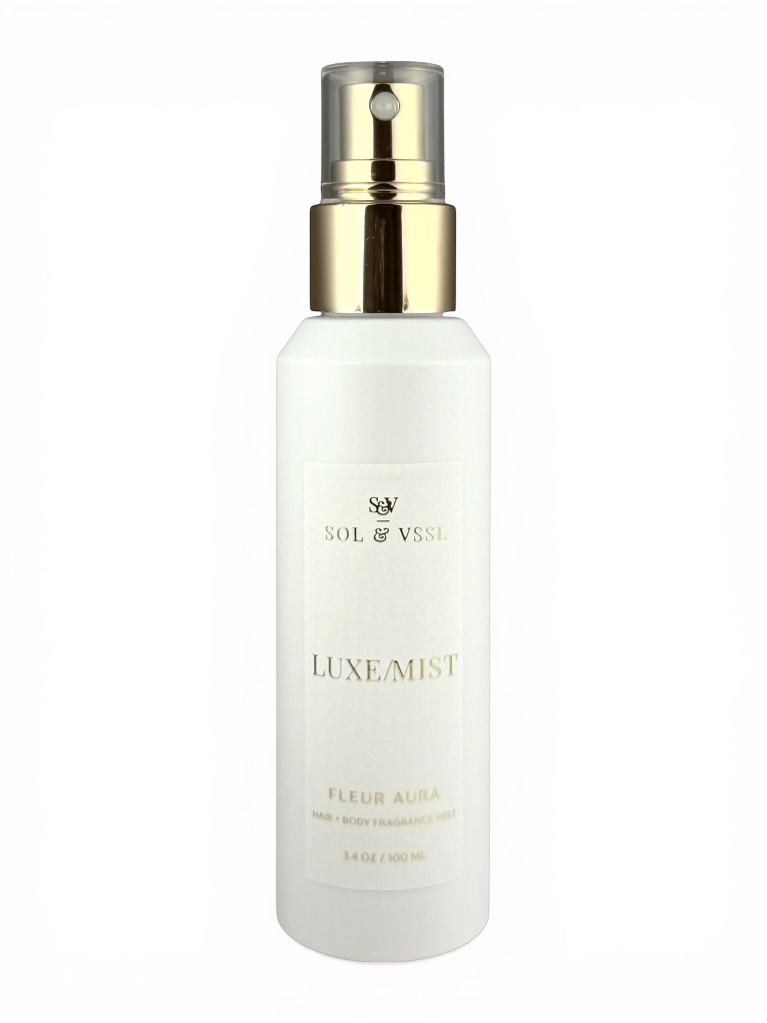 White spray bottle with gold cap labeled 'Luxe Mist' on a white background