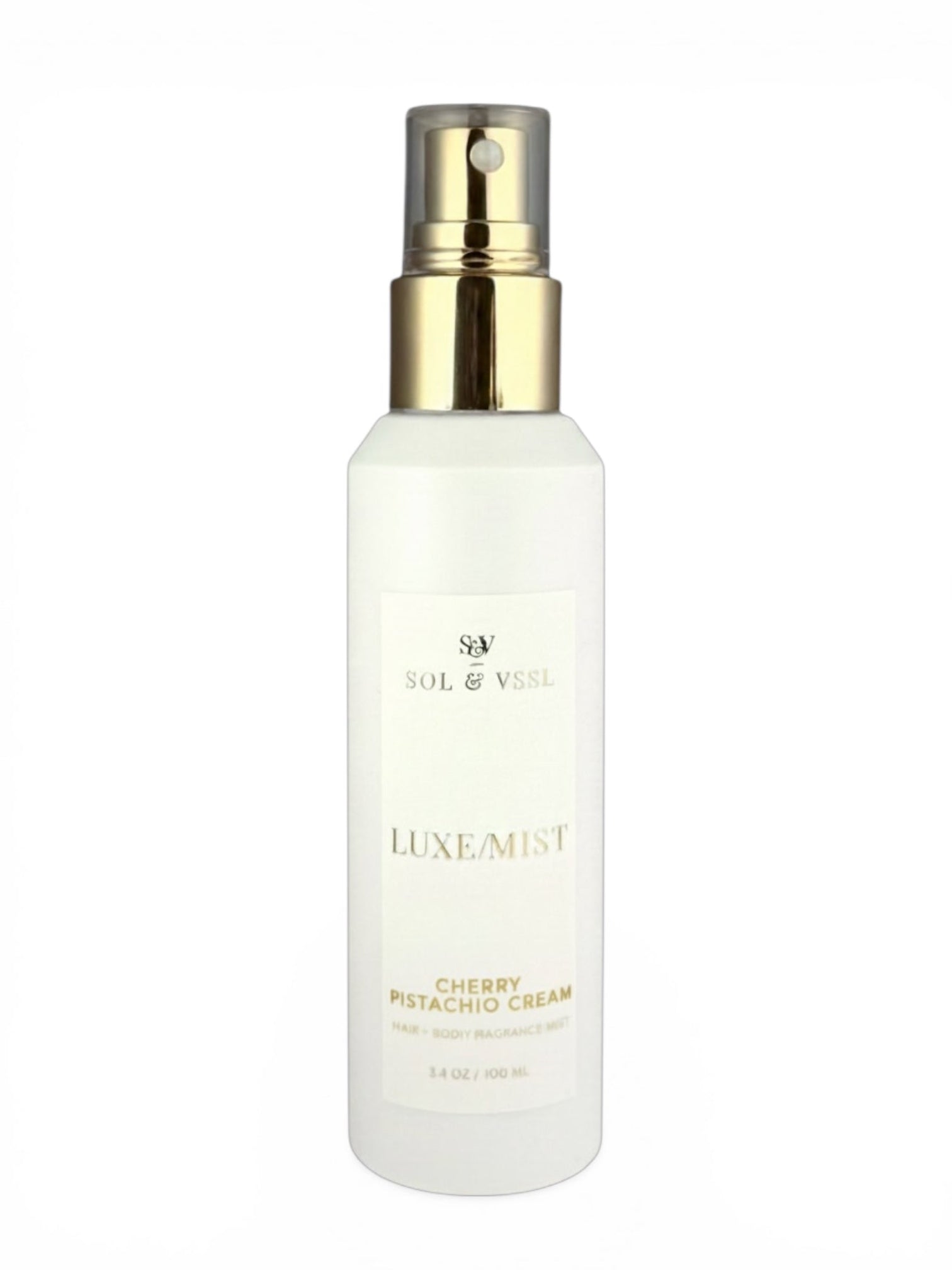 White spray bottle with gold cap labeled 'Luxe Mist' on a white background