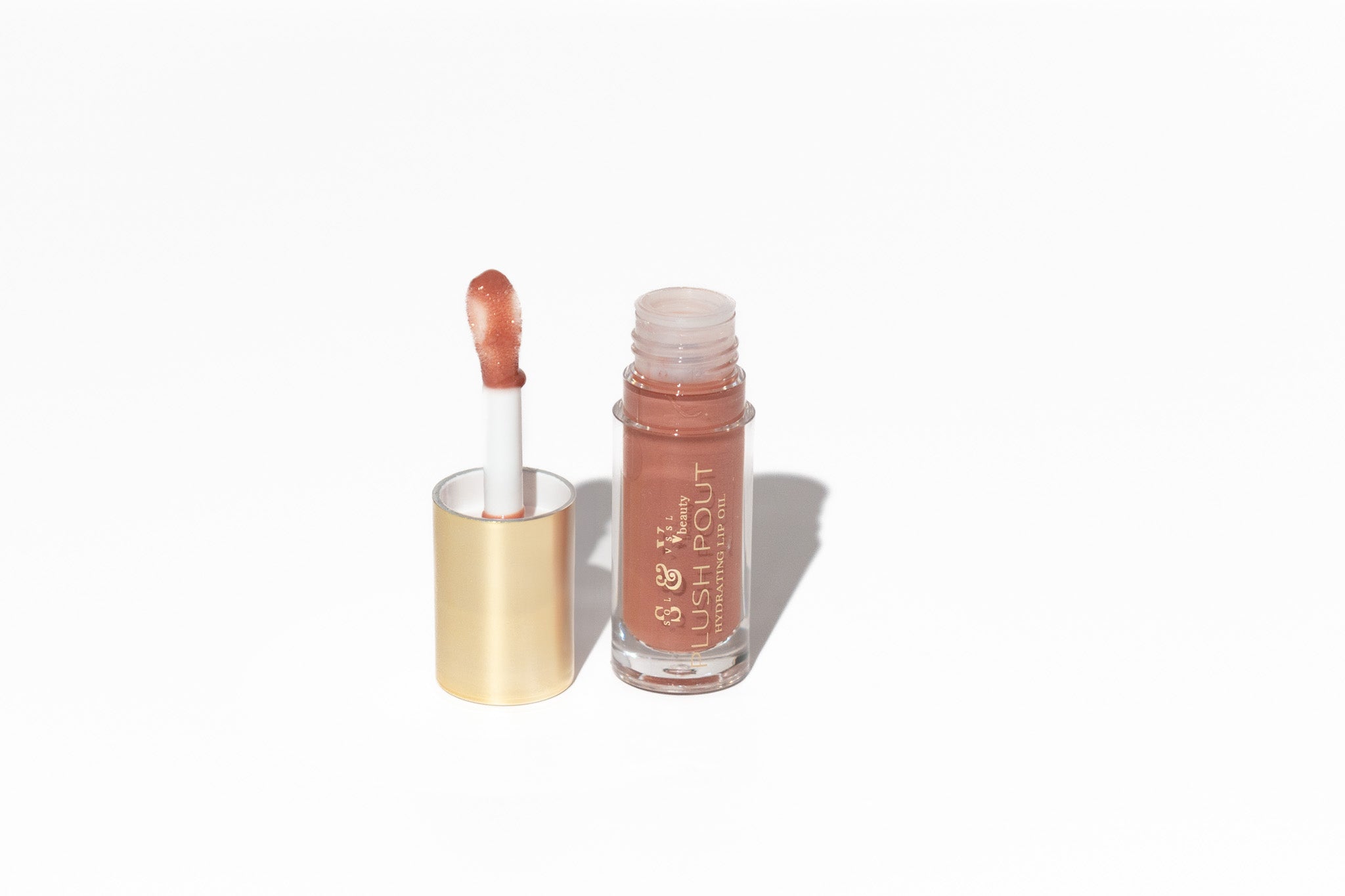 Lip gloss with applicator on a white background