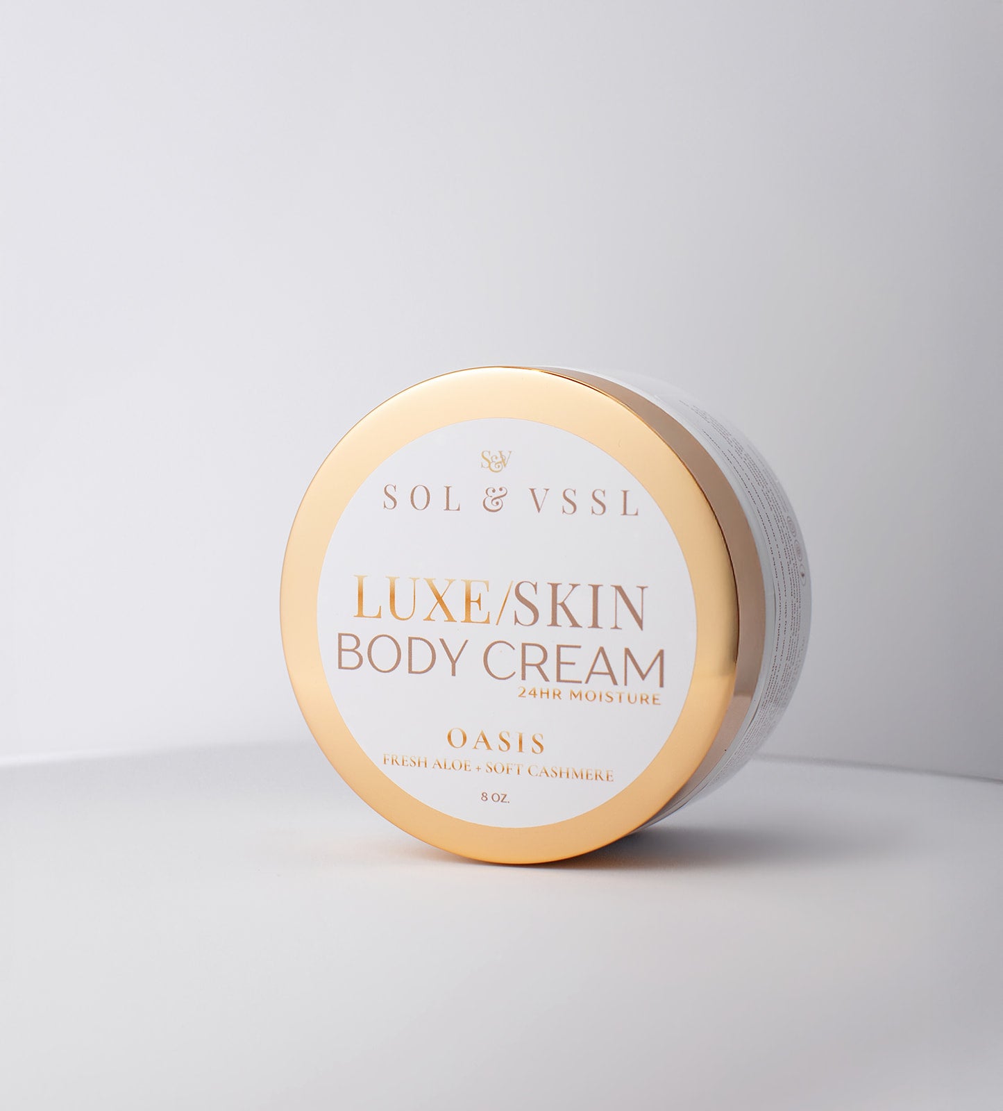 Jar of Luxe Skin Body Cream by Sol & Vssl on a light gray background