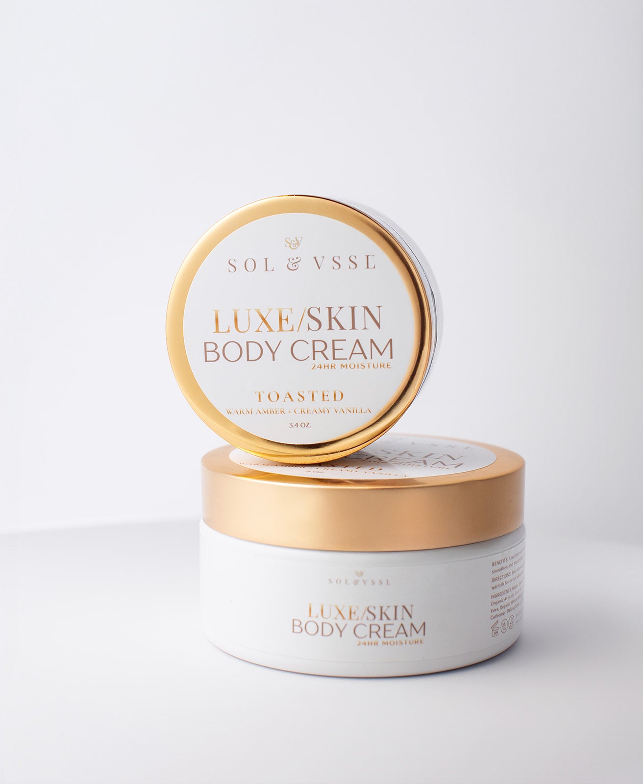 Two jars of Luxe Skin Body Cream by Sol & Vssl on a light gray background
