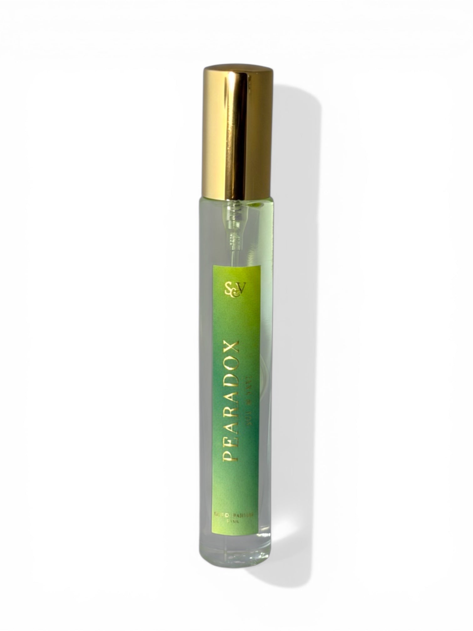 Paradox perfume bottle with gold cap on a white background
