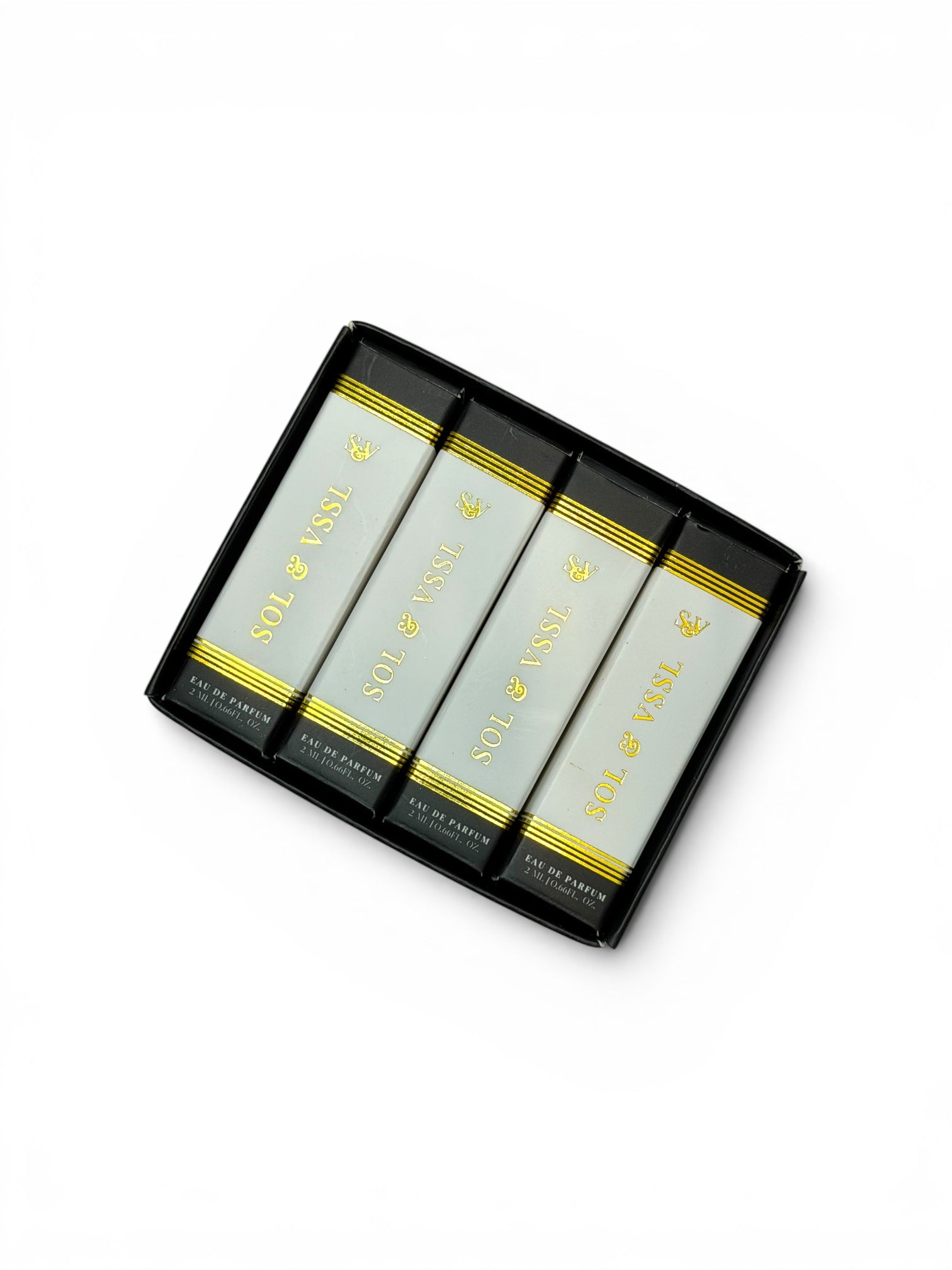 Set of four skincare bars in a black box with gold accents on a white background
