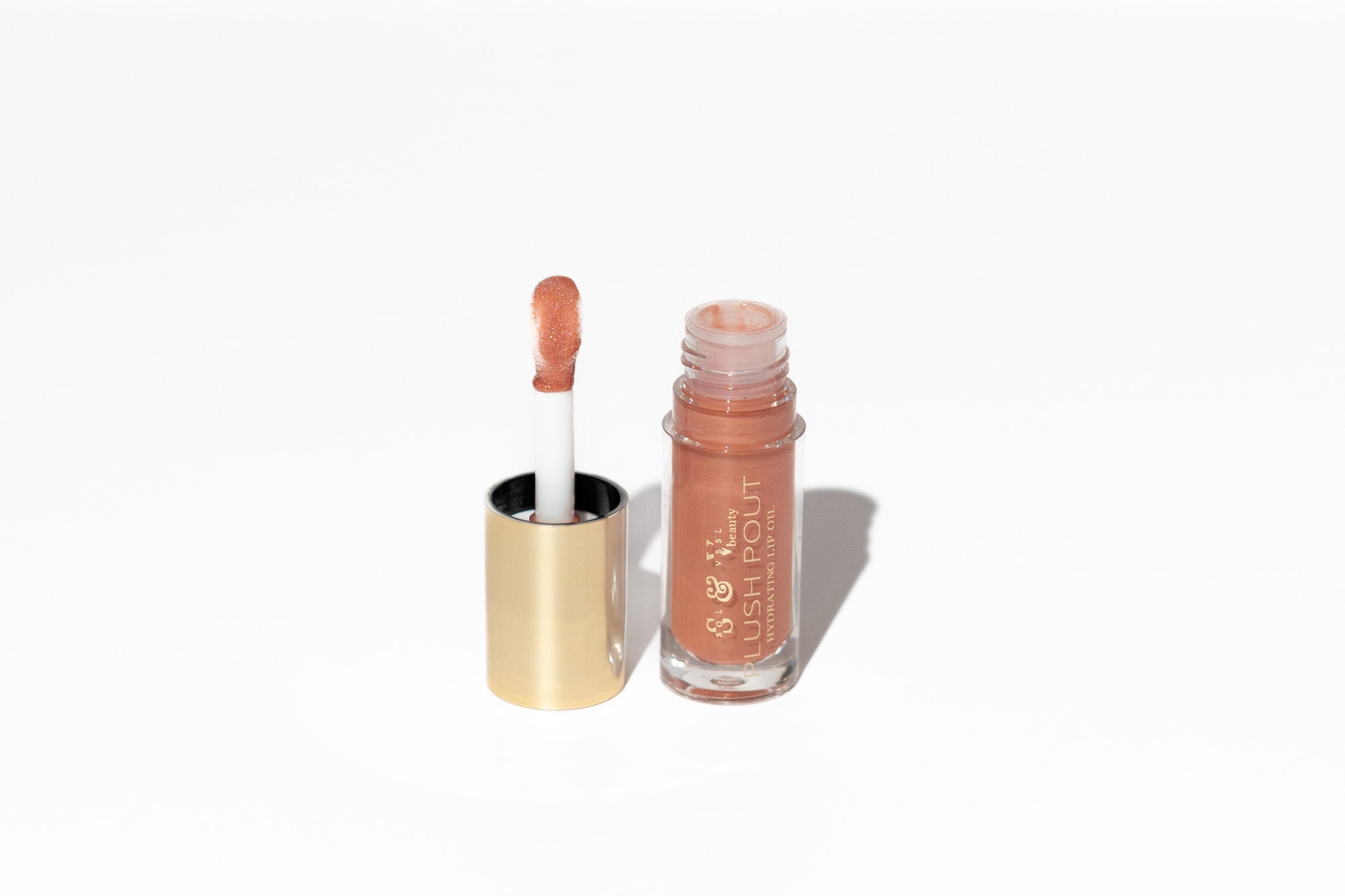 Lip gloss with applicator on a white background