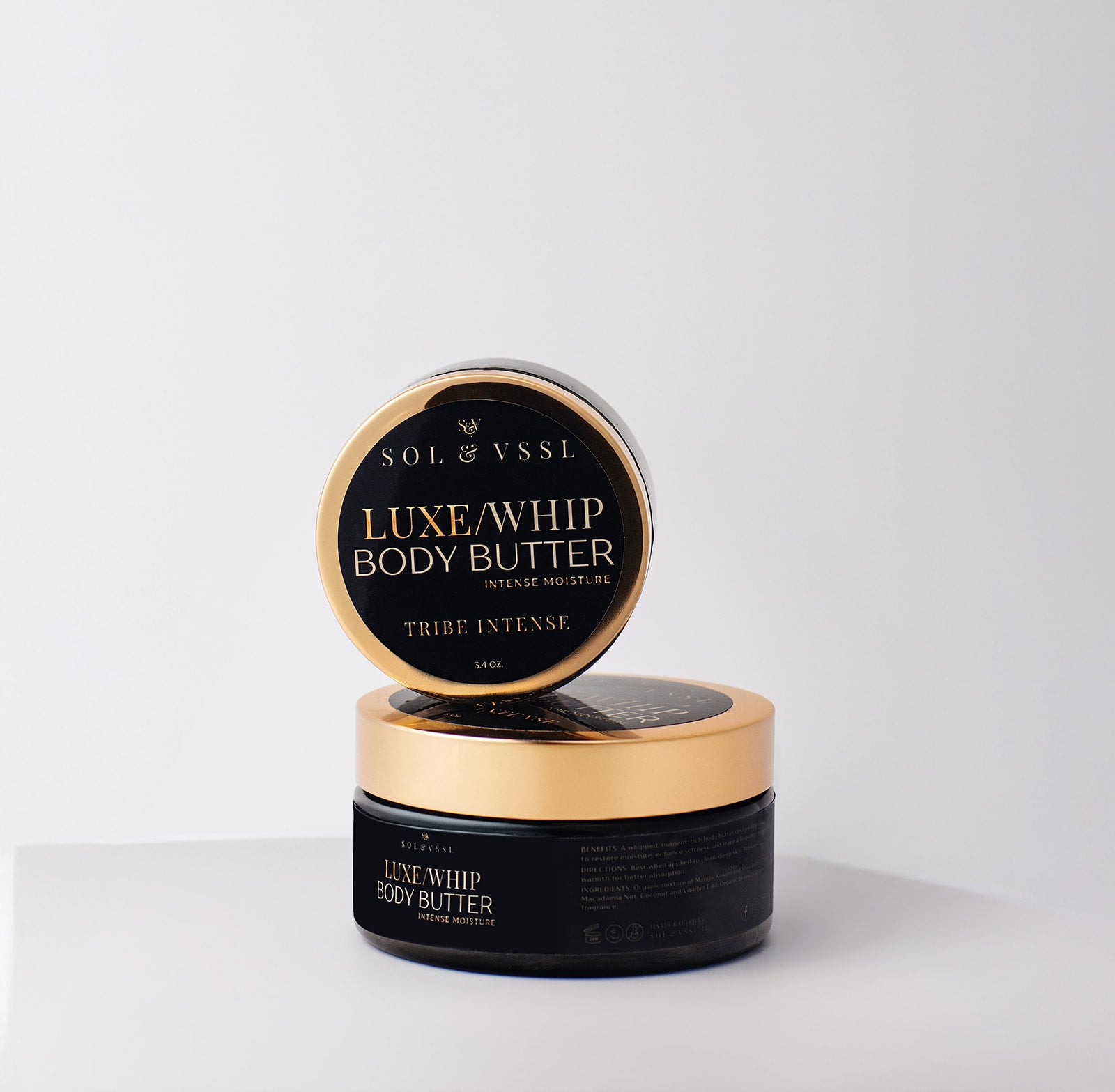 Sol & Vessel Luxe Whip Body Butter jar with open lid on a light gray background